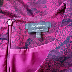 Close-up of a pink garment with 'diana ferrari' label and size tag.