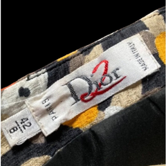Close-up of a Dior label on a patterned fabric background