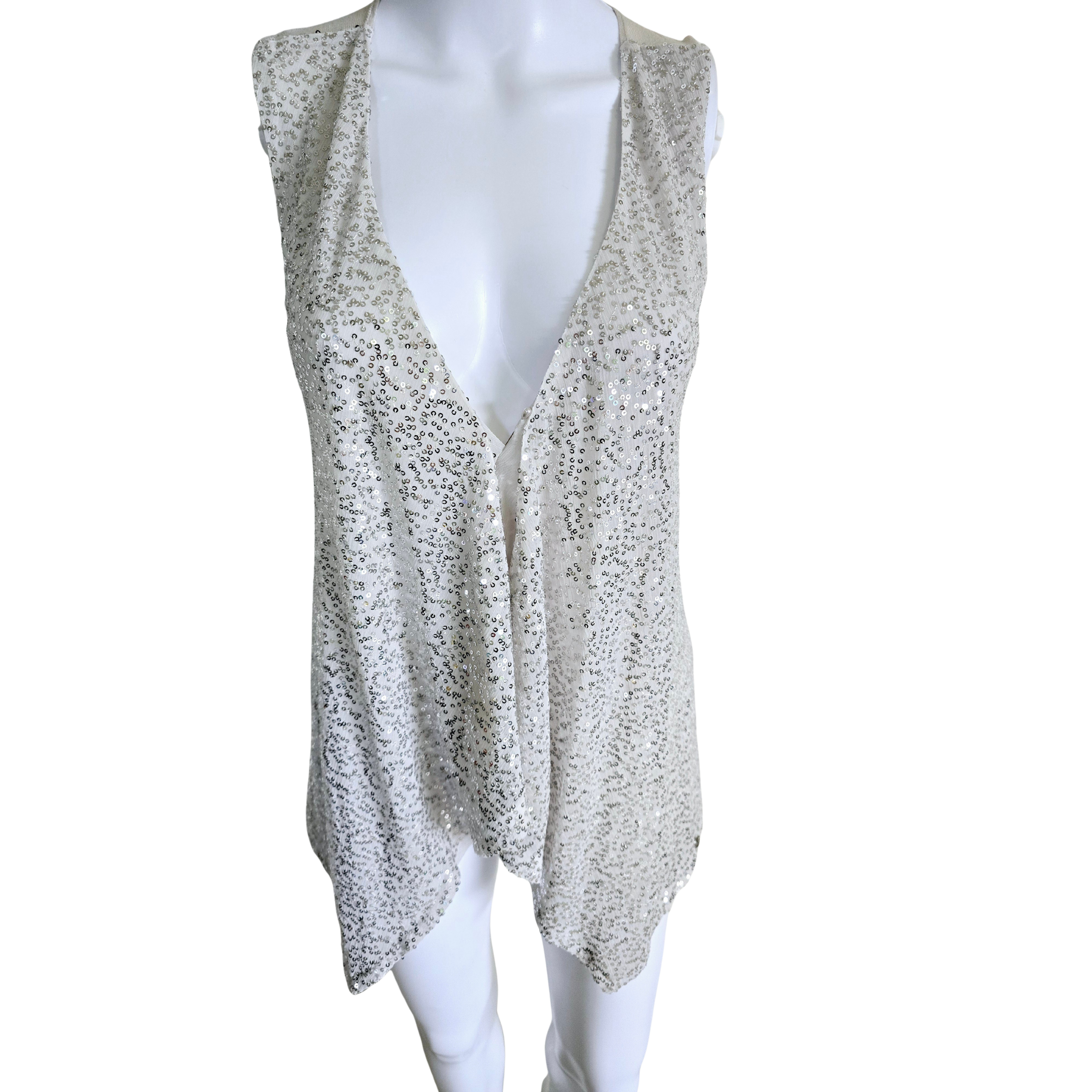 White sleeveless top with subtle pattern on a white background