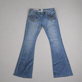 Pair of blue jeans on a gray background