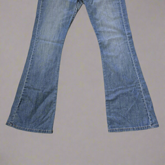 Pair of blue jeans on a plain background