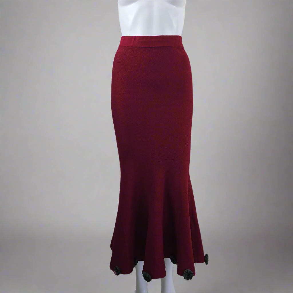 Maroon pencil skirt on a mannequin against a plain background