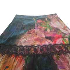 Floral patterned fabric with lace trim on a plain background