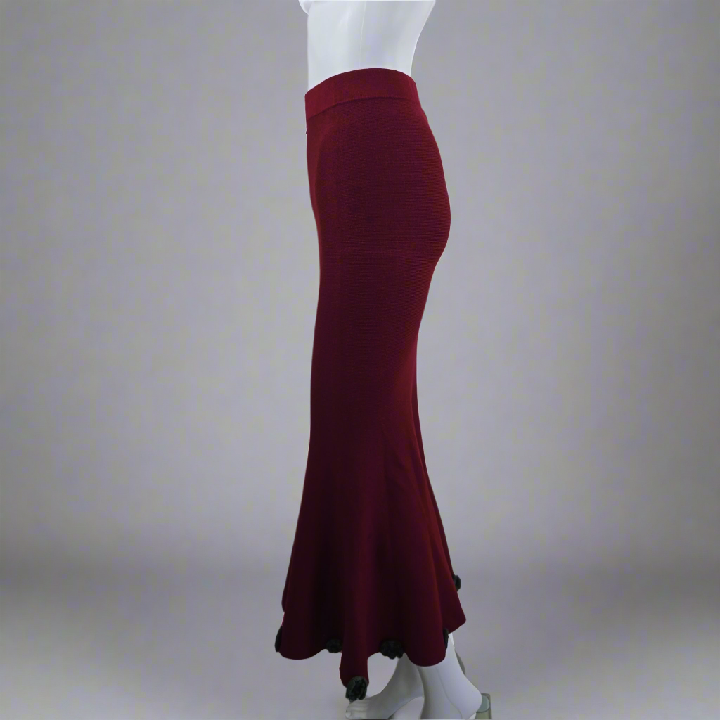 Maroon skirt on a mannequin against a plain background