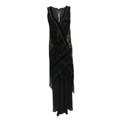 Black evening gown with intricate detailing on a gray background