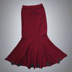 Red skirt with decorative buttons on a light gray background