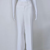 White pants on a mannequin against a plain background