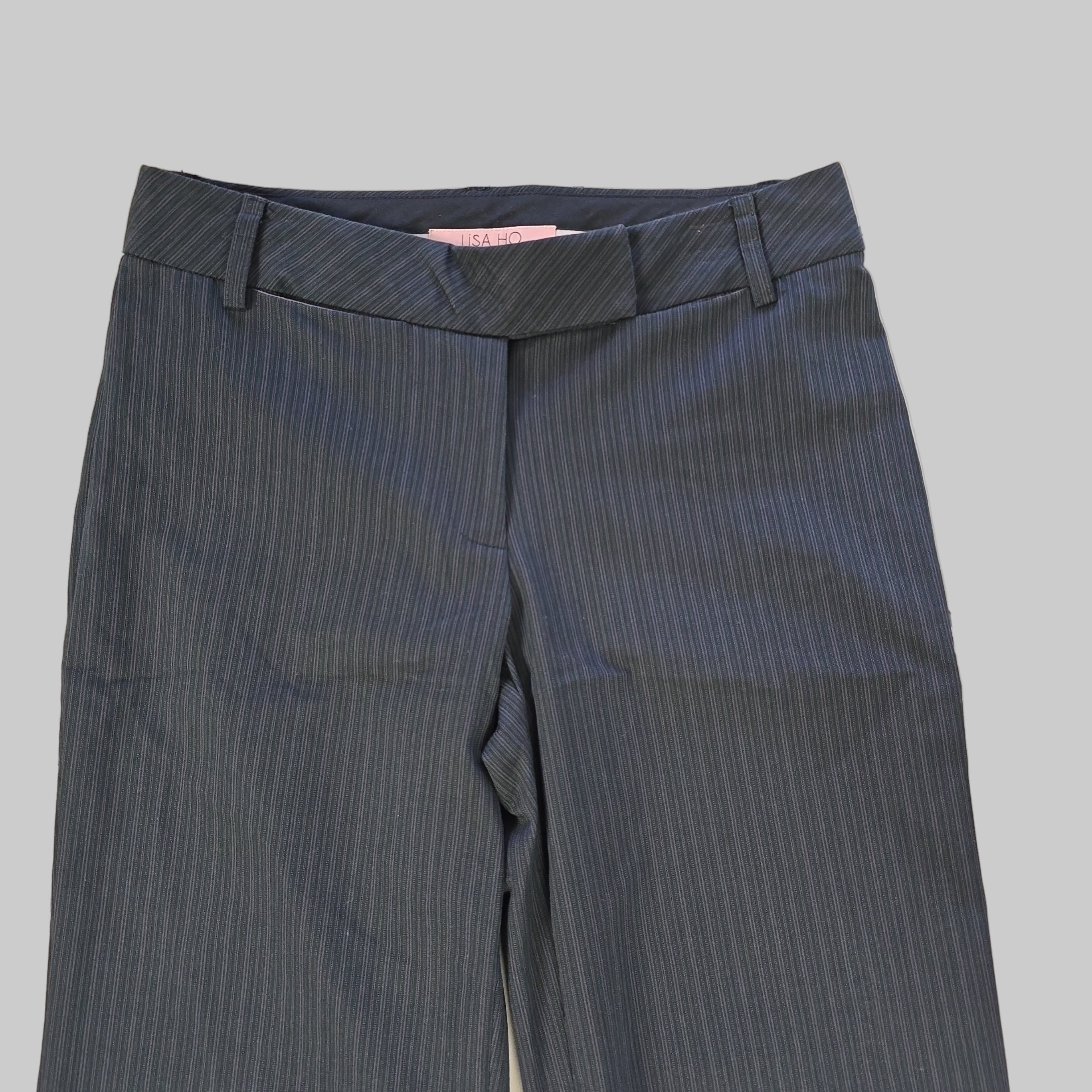 Dark grey striped pants on a tiled floor