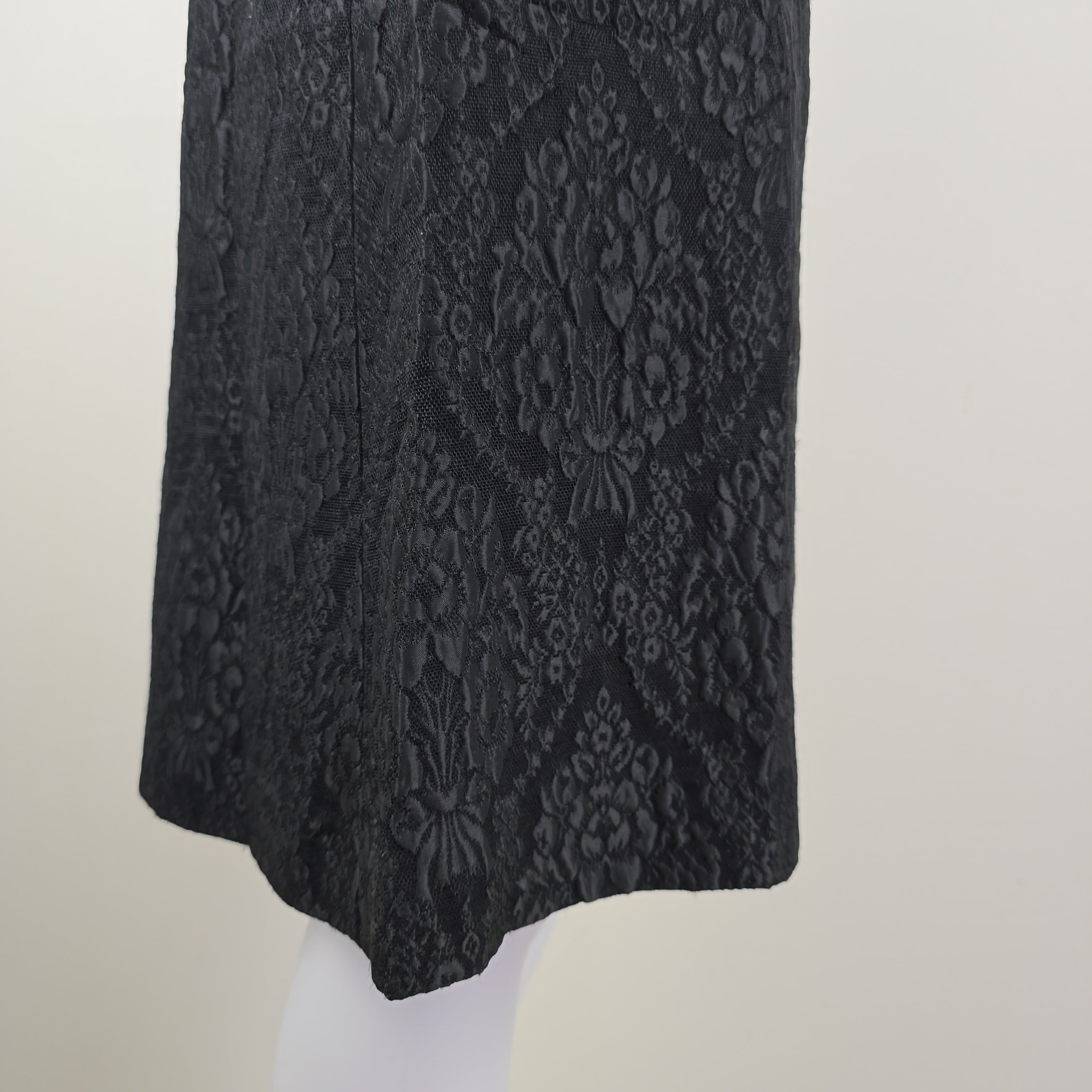 Black textured skirt on a white background
