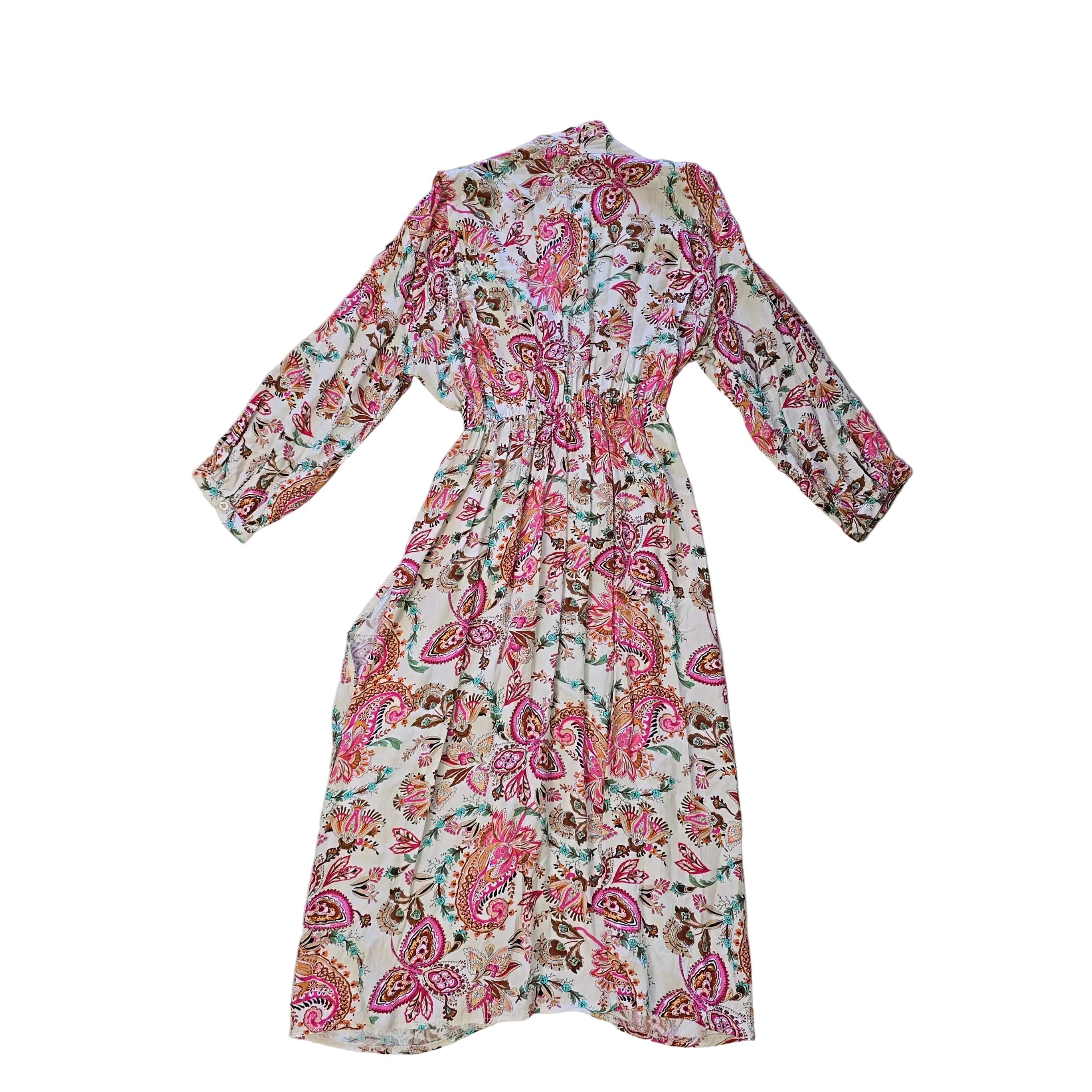 Floral patterned wrap style dress on a light background