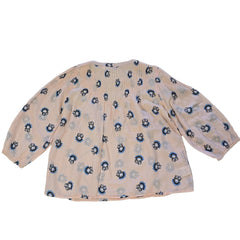 Floral-patterned flowy top on a light background