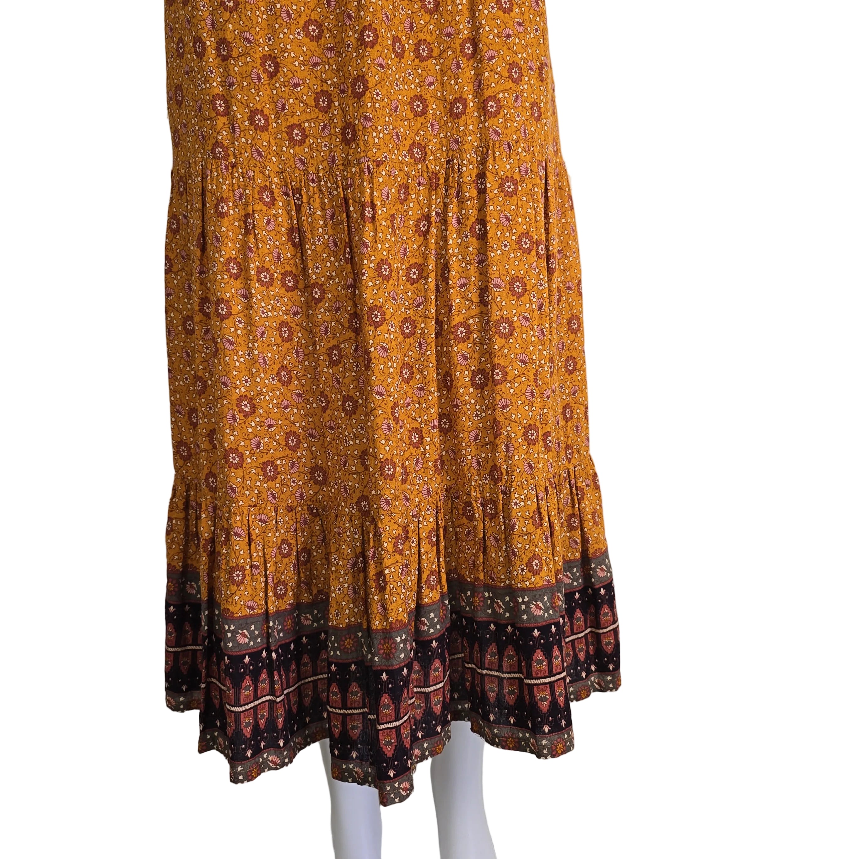 Brown patterned maxi skirt on a light background