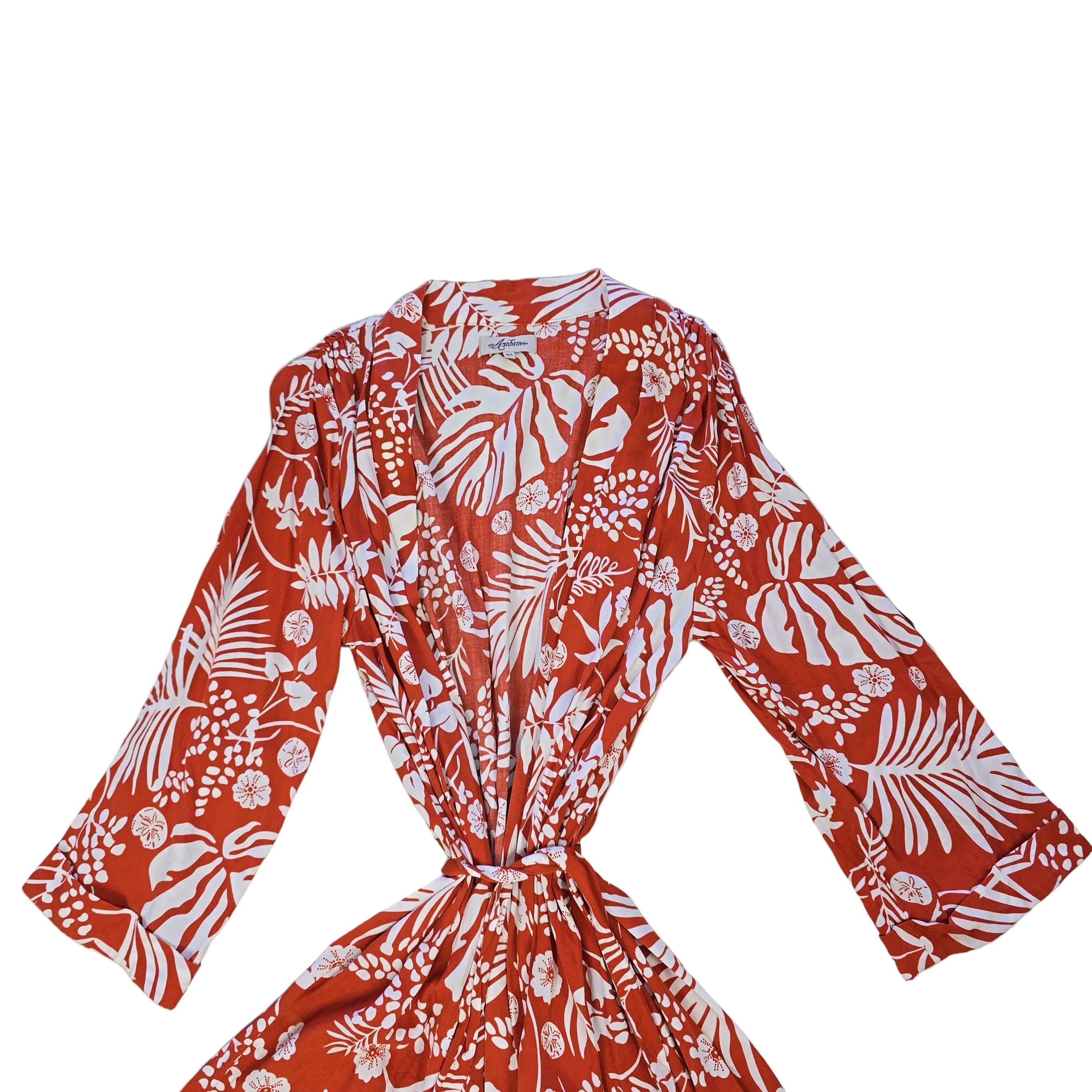 Orange and white palm patterned robe on a light background