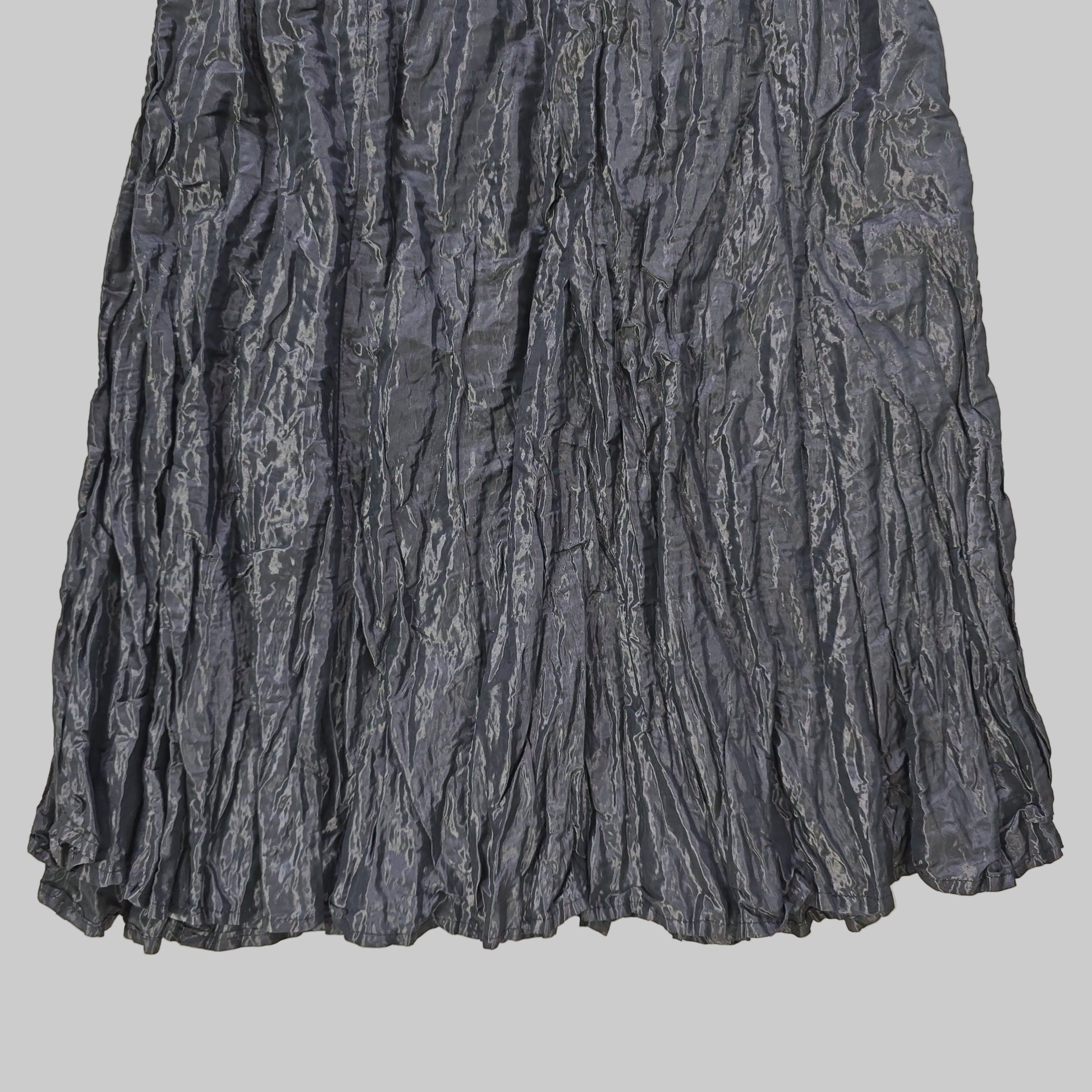 Black skirt on a tiled floor