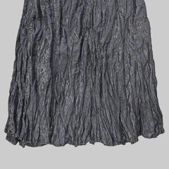 Black skirt on a tiled floor