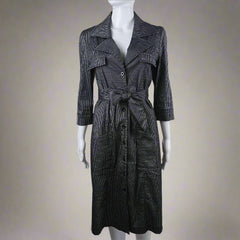 Black coat with a bow tie on a mannequin against a white background