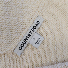 Textile label on a beige knitted fabric