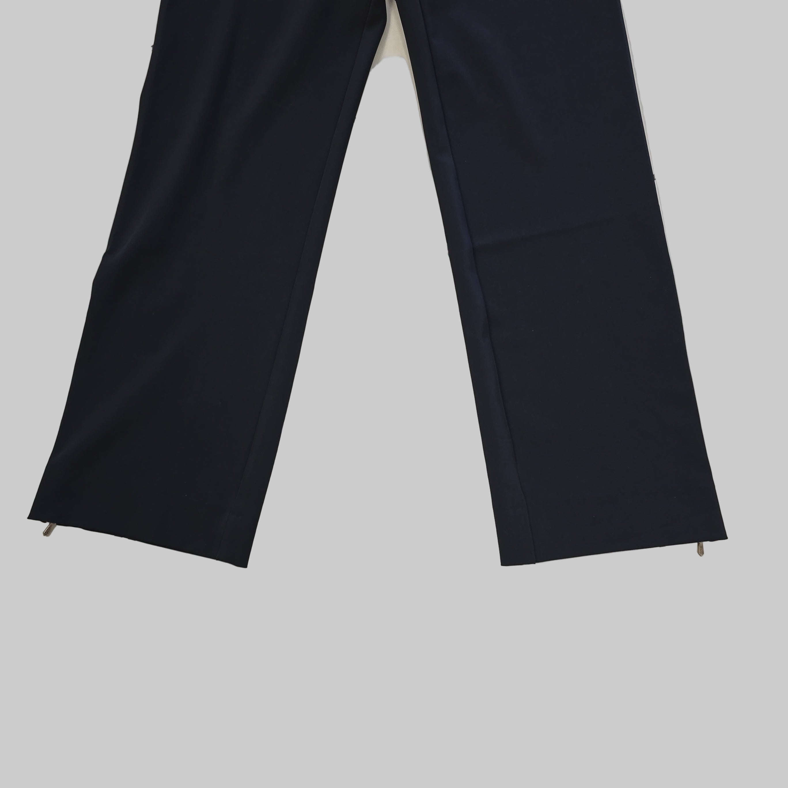 Black leg pants on a tiled floor