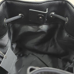Close-up of a black bag with a visible brand tag.