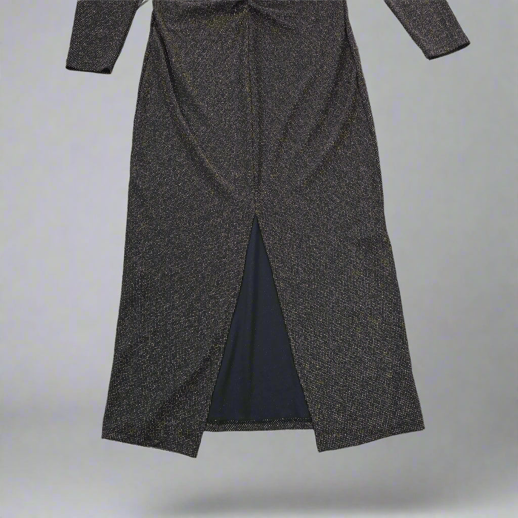 Black and gold textured dress against a light gray background