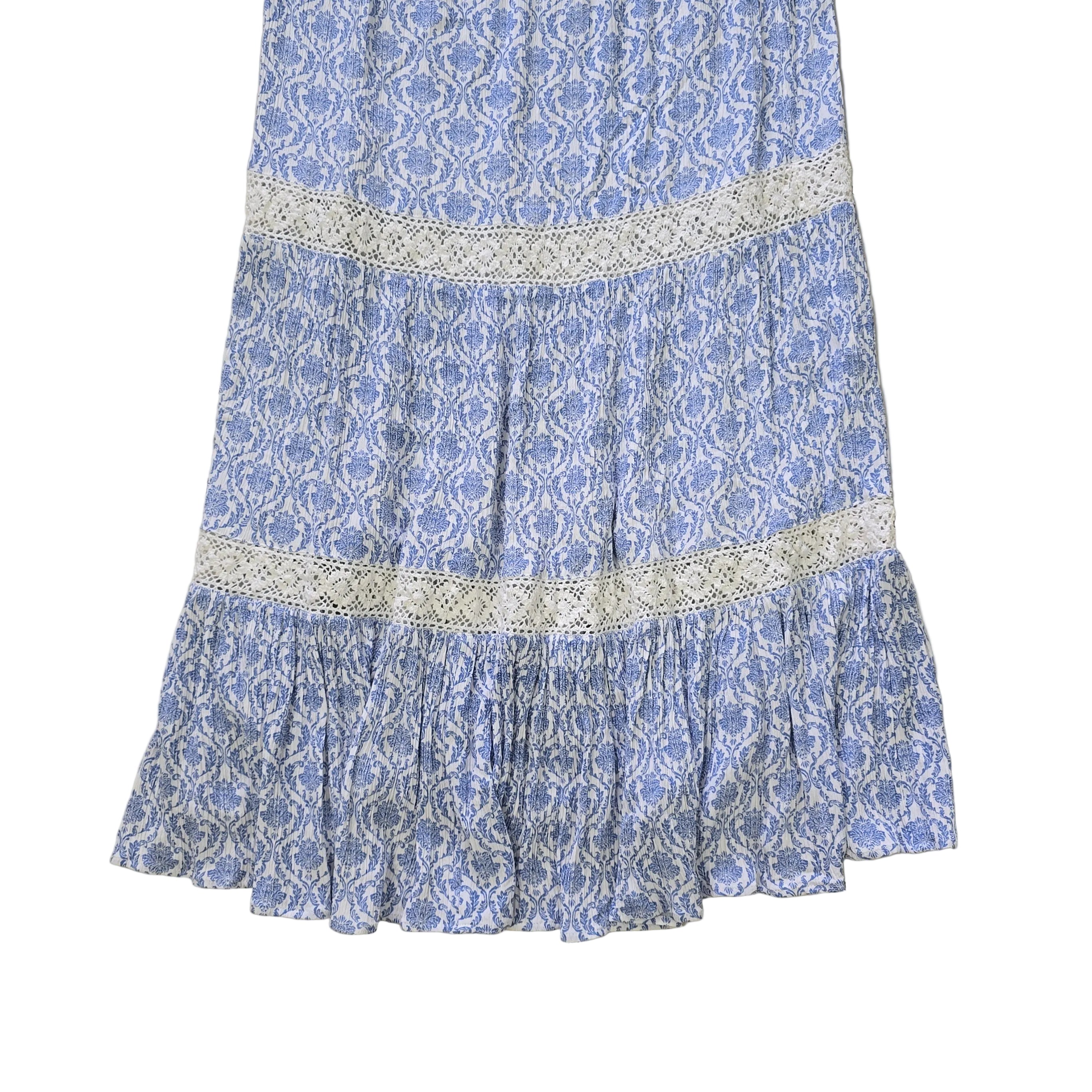 Blue and white patterned dress on a light background