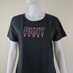 Black tank top with pink 'DKNY Sport' logo on a mannequin against a beige background