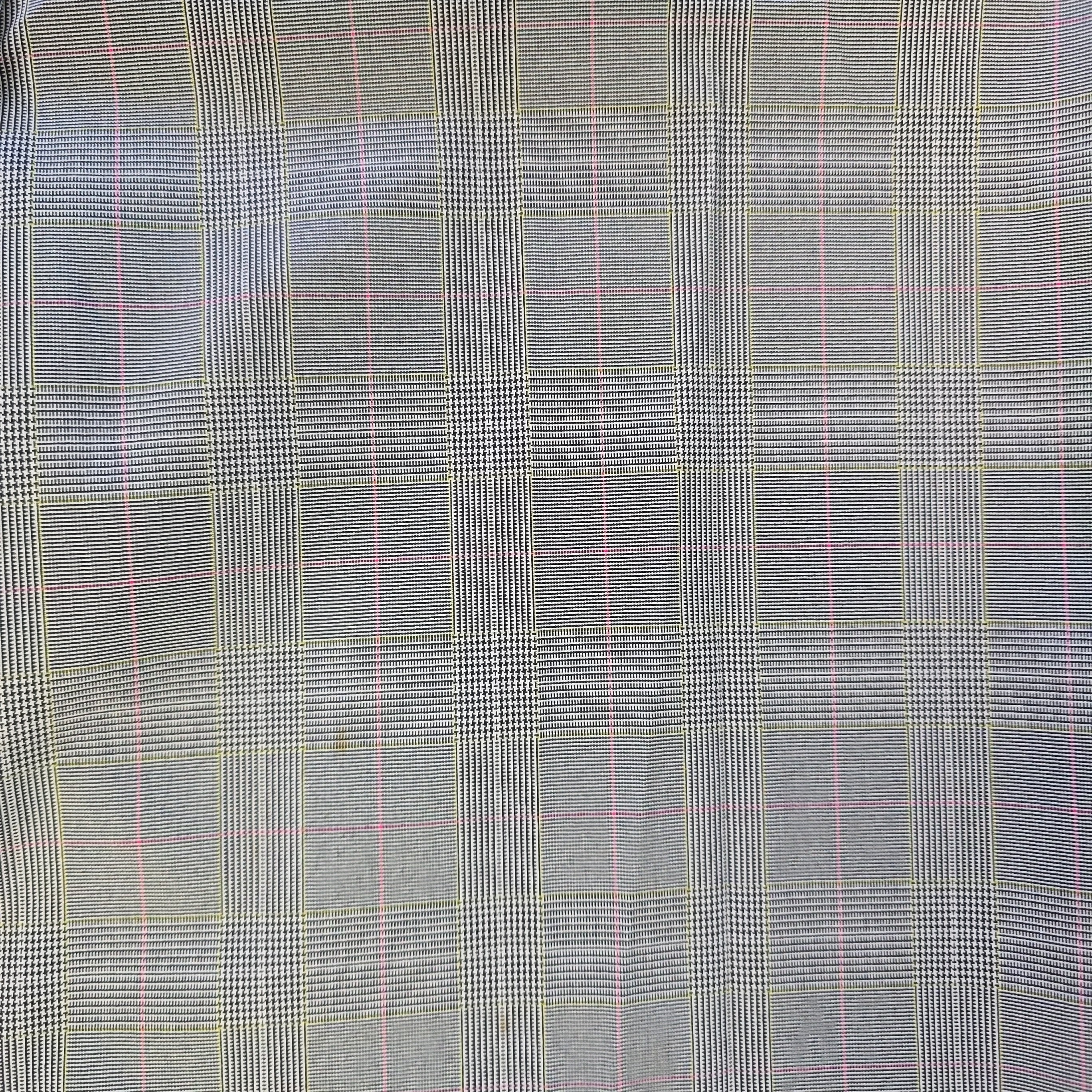 Plaid fabric pattern with a checkered design on a gray background