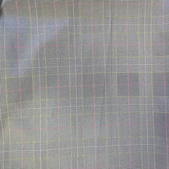Plaid fabric pattern with a checkered design on a gray background
