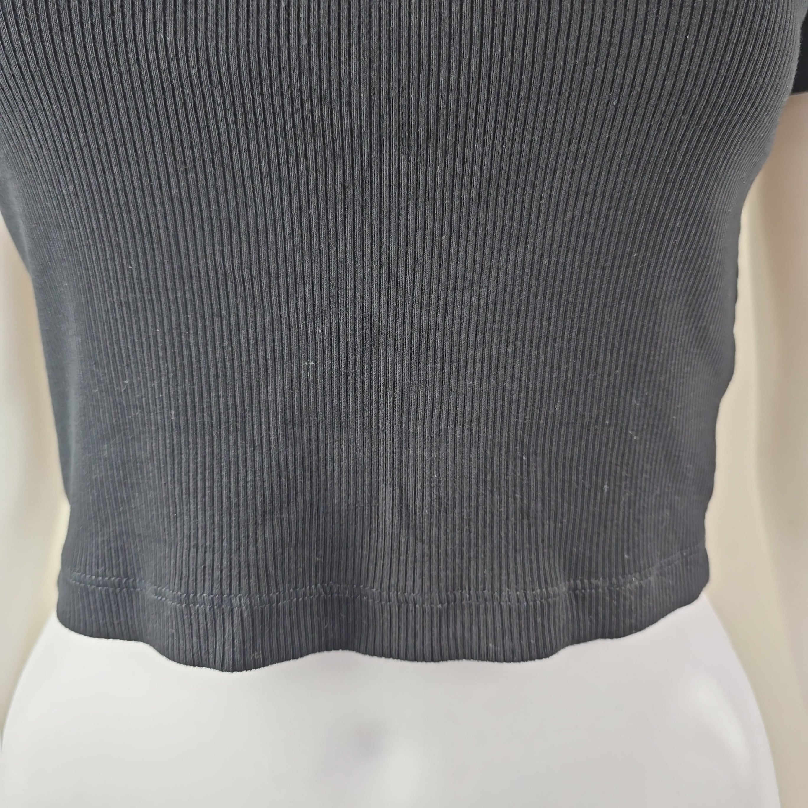 Close-up of a textured gray fabric with a white background