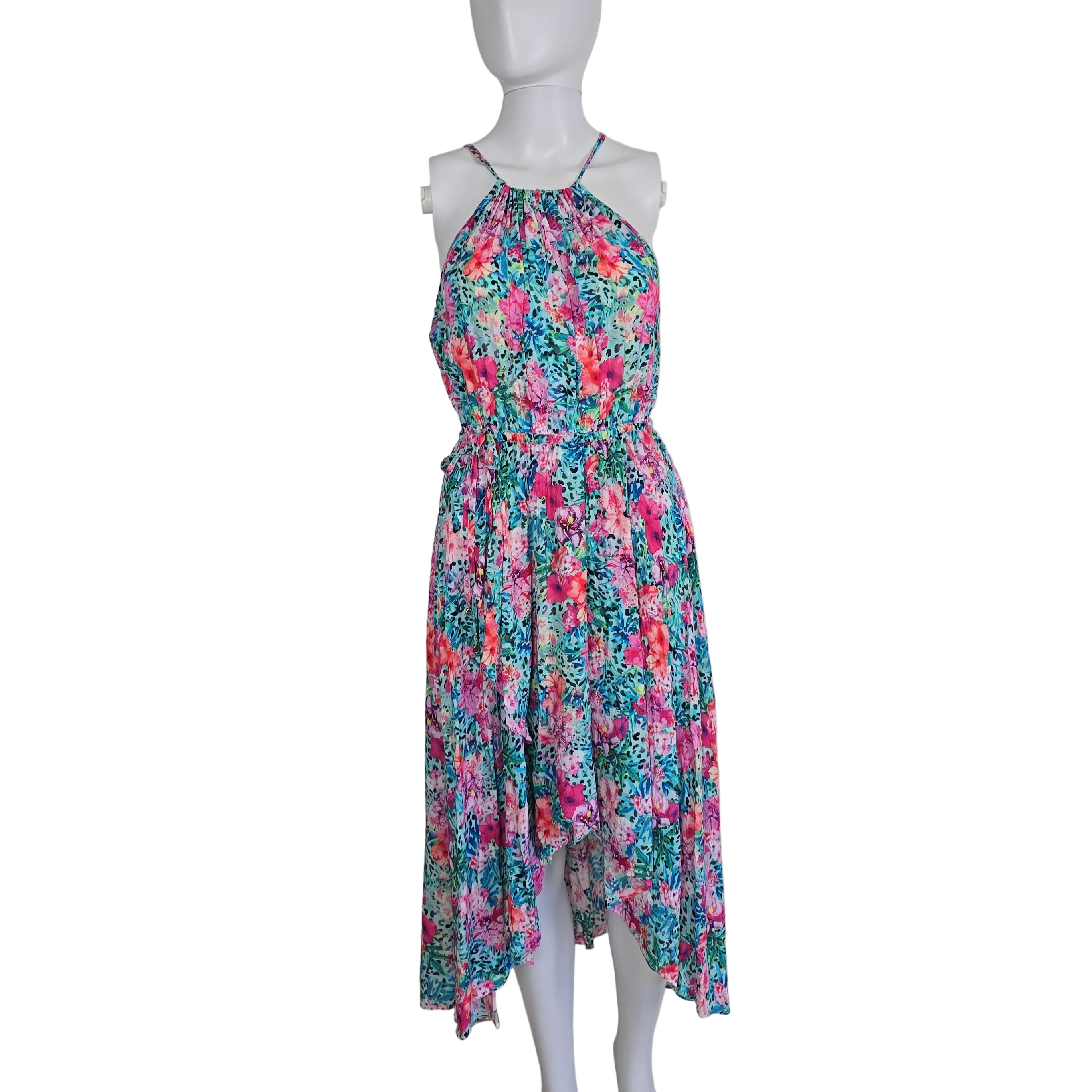 Floral dress on a mannequin against a plain background