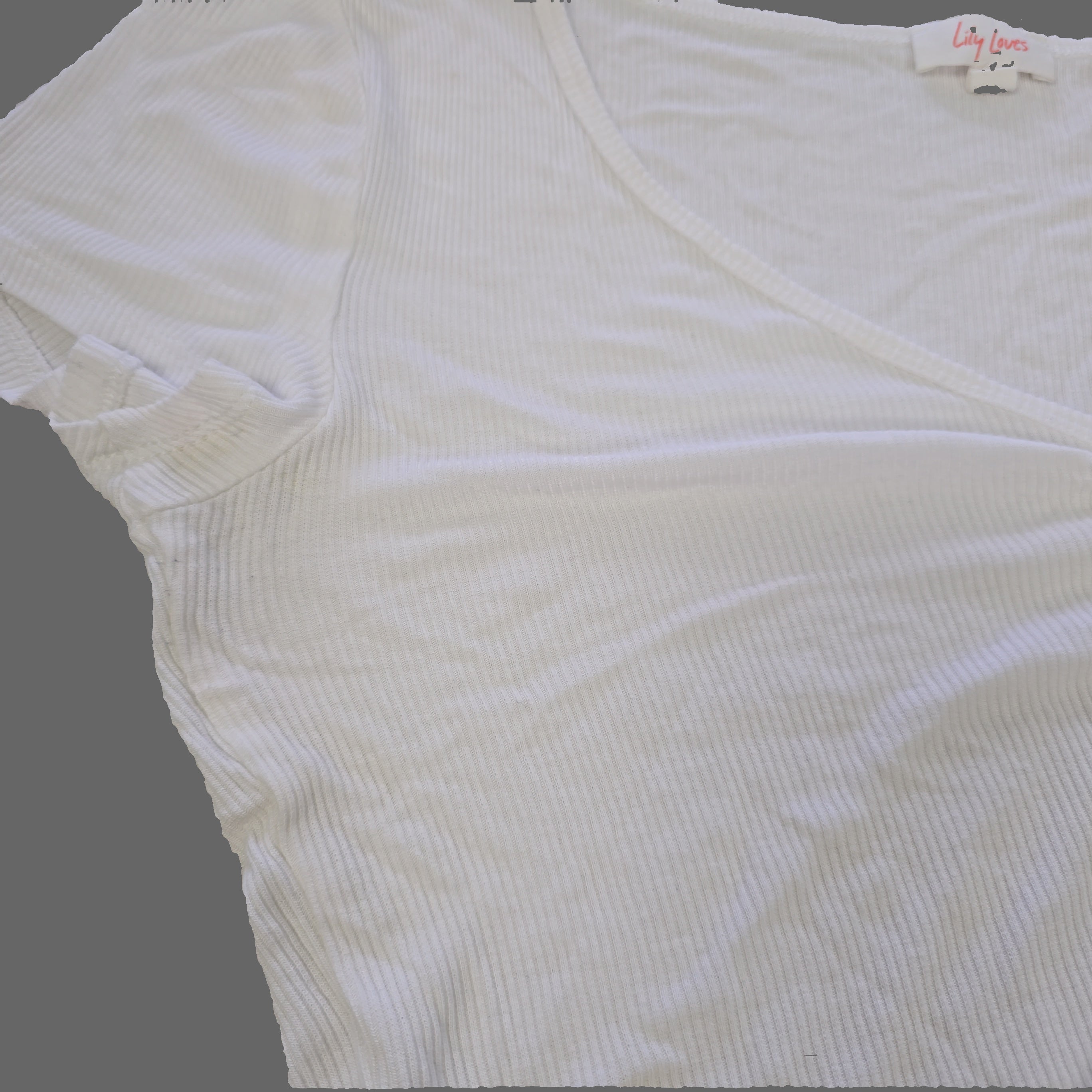 White ribbed tank top on a light gray surface