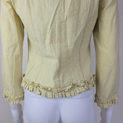 Light yellow jacket with frill details on a light background