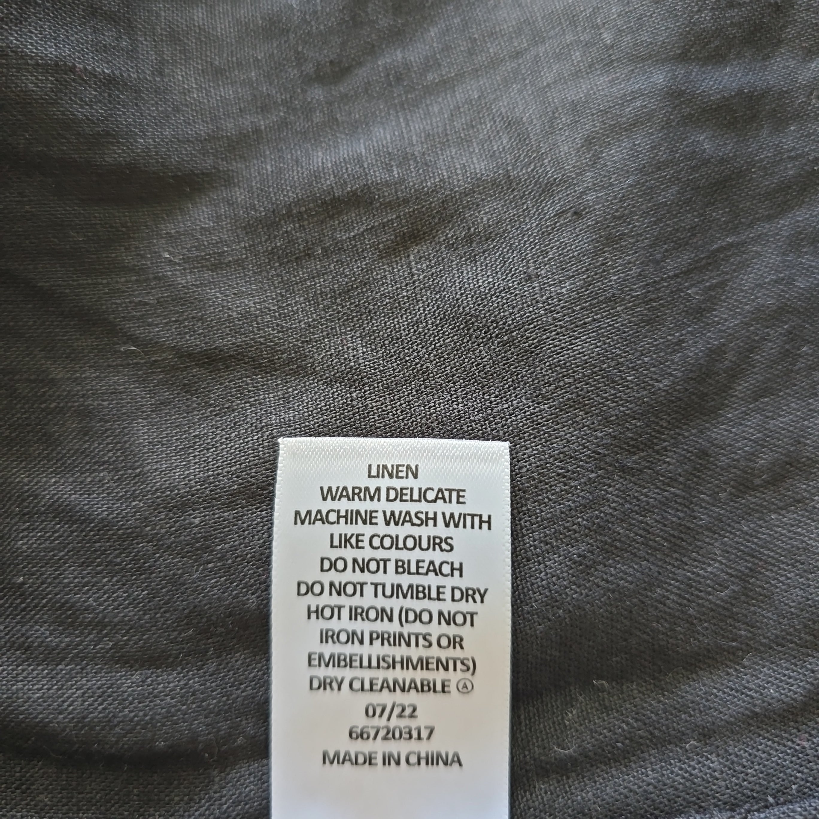 Fabric label on a gray fabric background