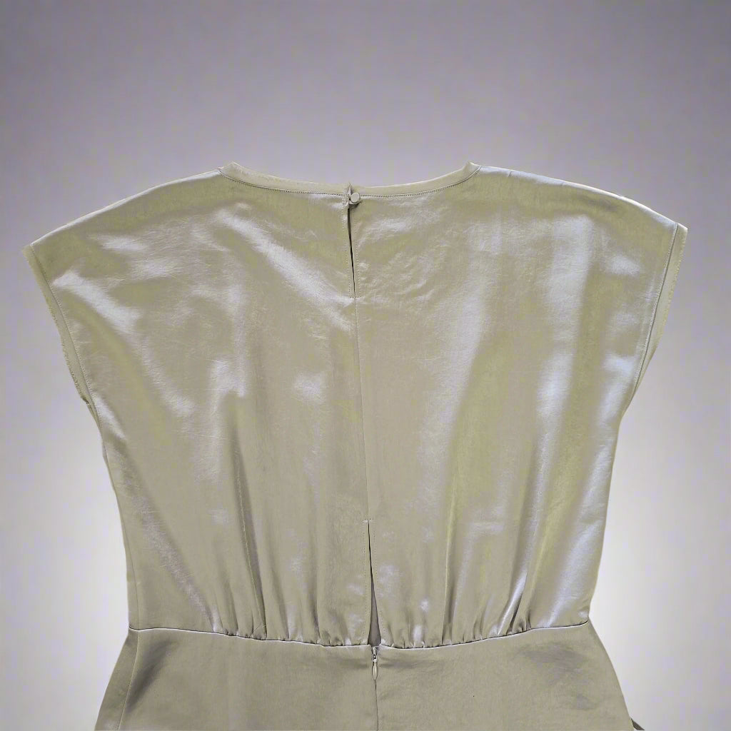Olive strapless dress on a tiled floor