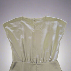 Olive strapless dress on a tiled floor