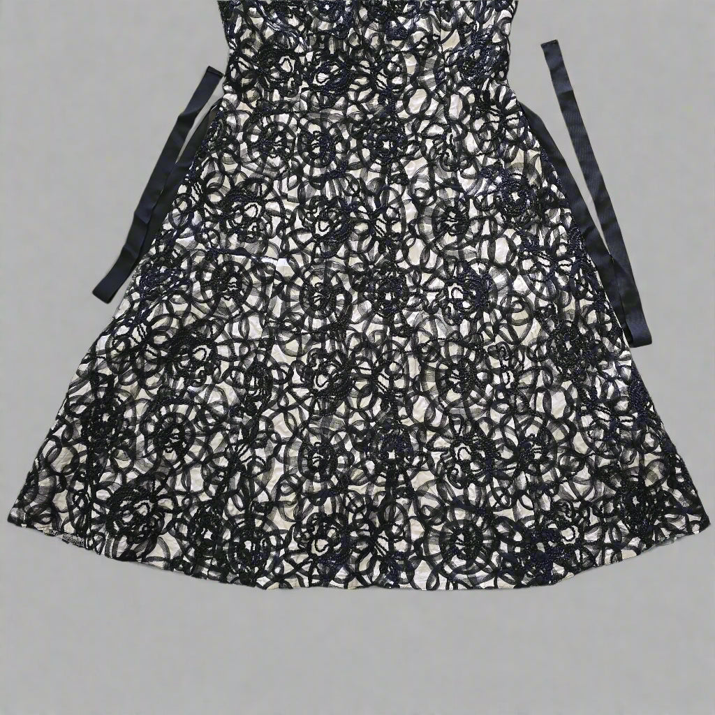 Black lace skirt on a tiled floor