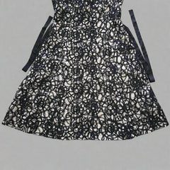 Black lace skirt on a tiled floor