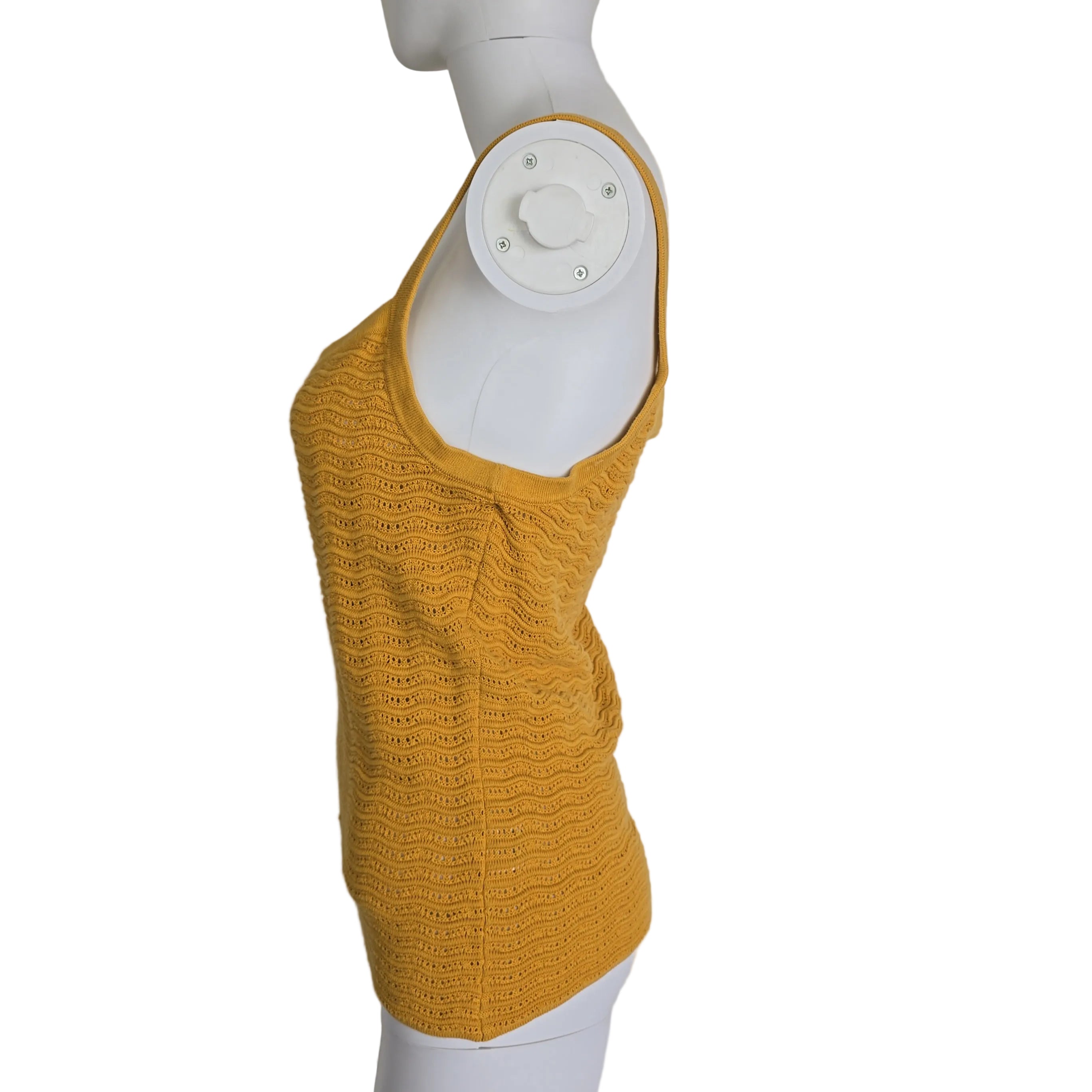 Yellow knitted tank top on a light background