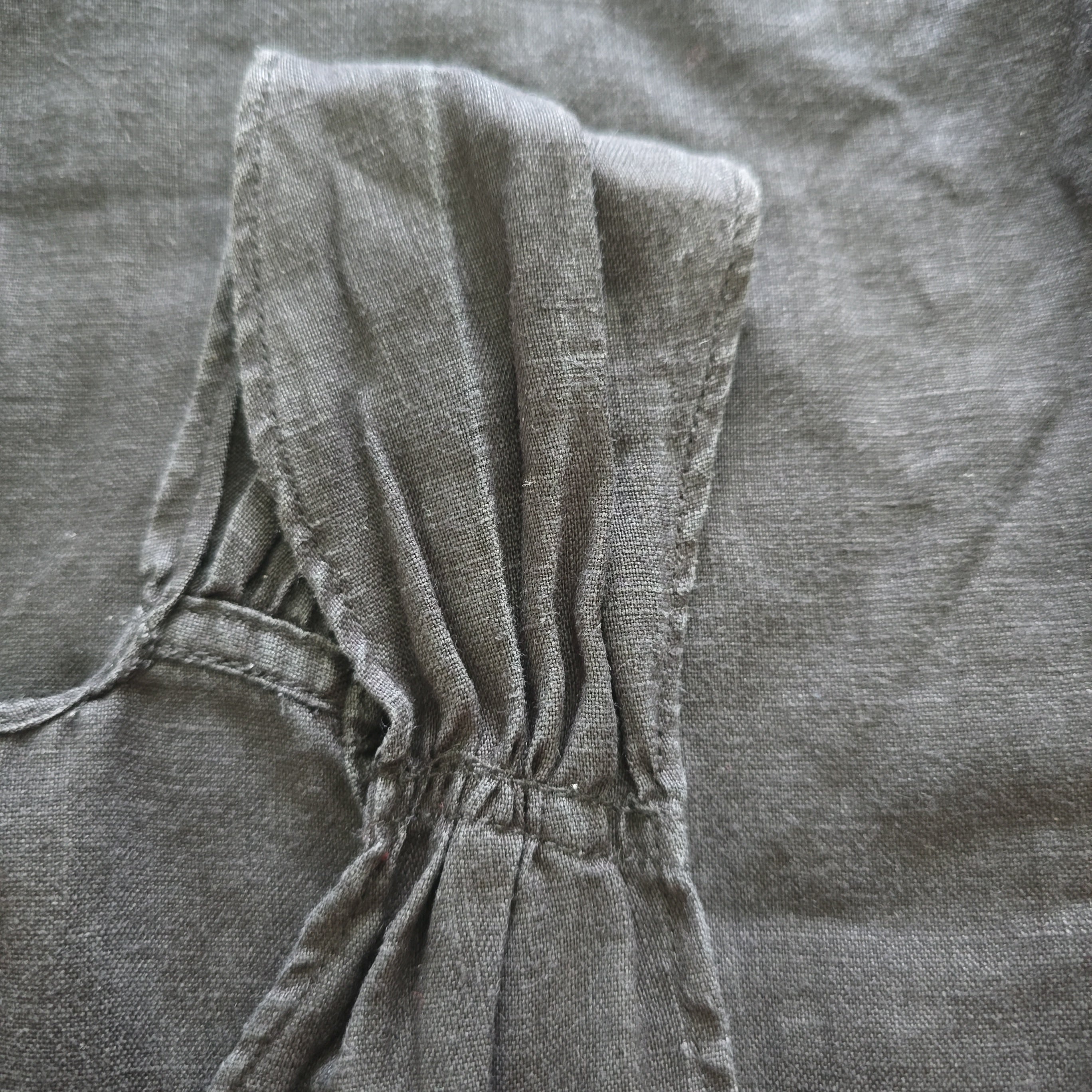 Close-up of a gray fabric with a tie detail