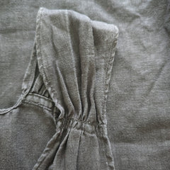 Close-up of a gray fabric with a tie detail