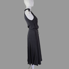 Grey dress on a mannequin against a white wall