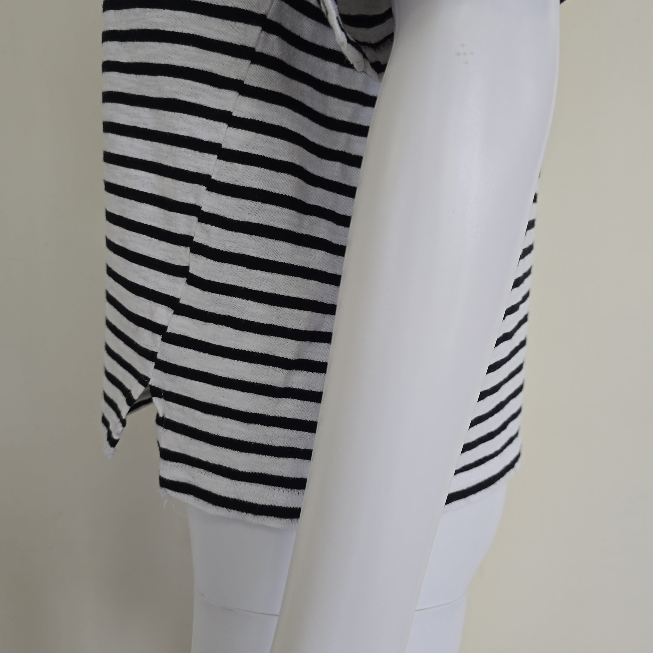 Close-up of a black and white striped shirt on a light background