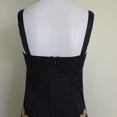 Black dress with lace details on a white background