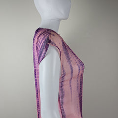 Purple and pink fabric on a white surface with a neutral background