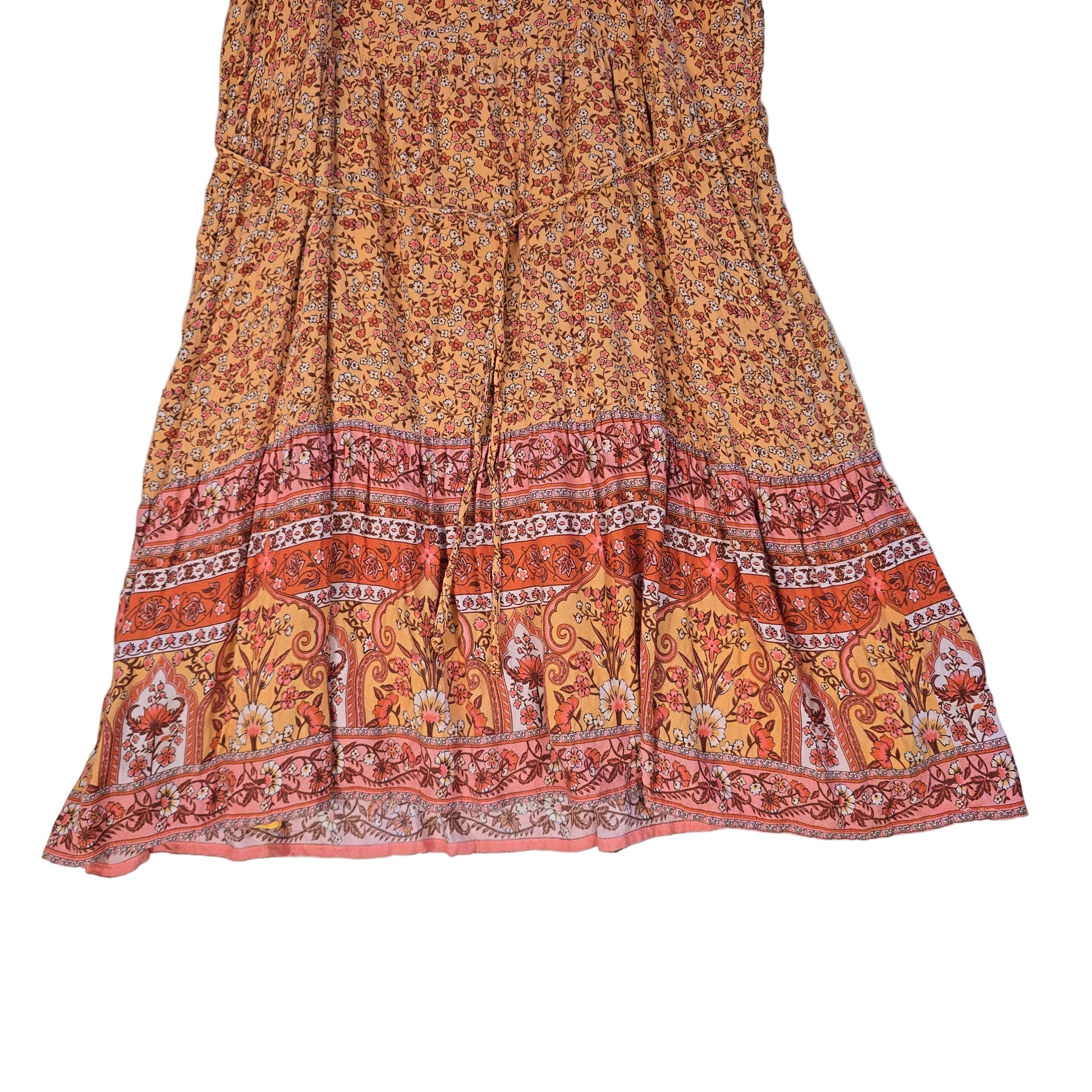 Orange patterned dress on a light background