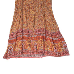 Orange patterned dress on a light background