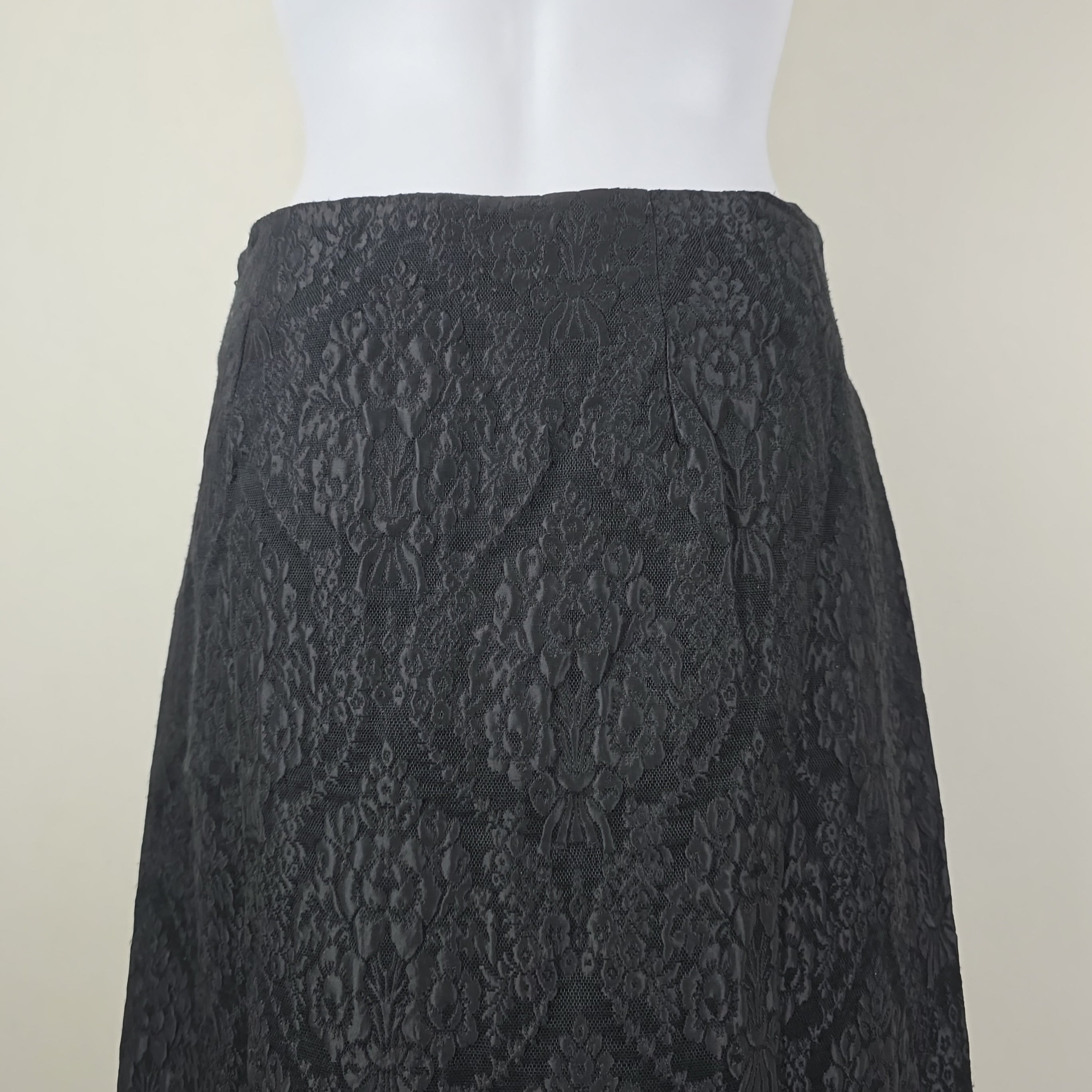 Textured black skirt on a white background