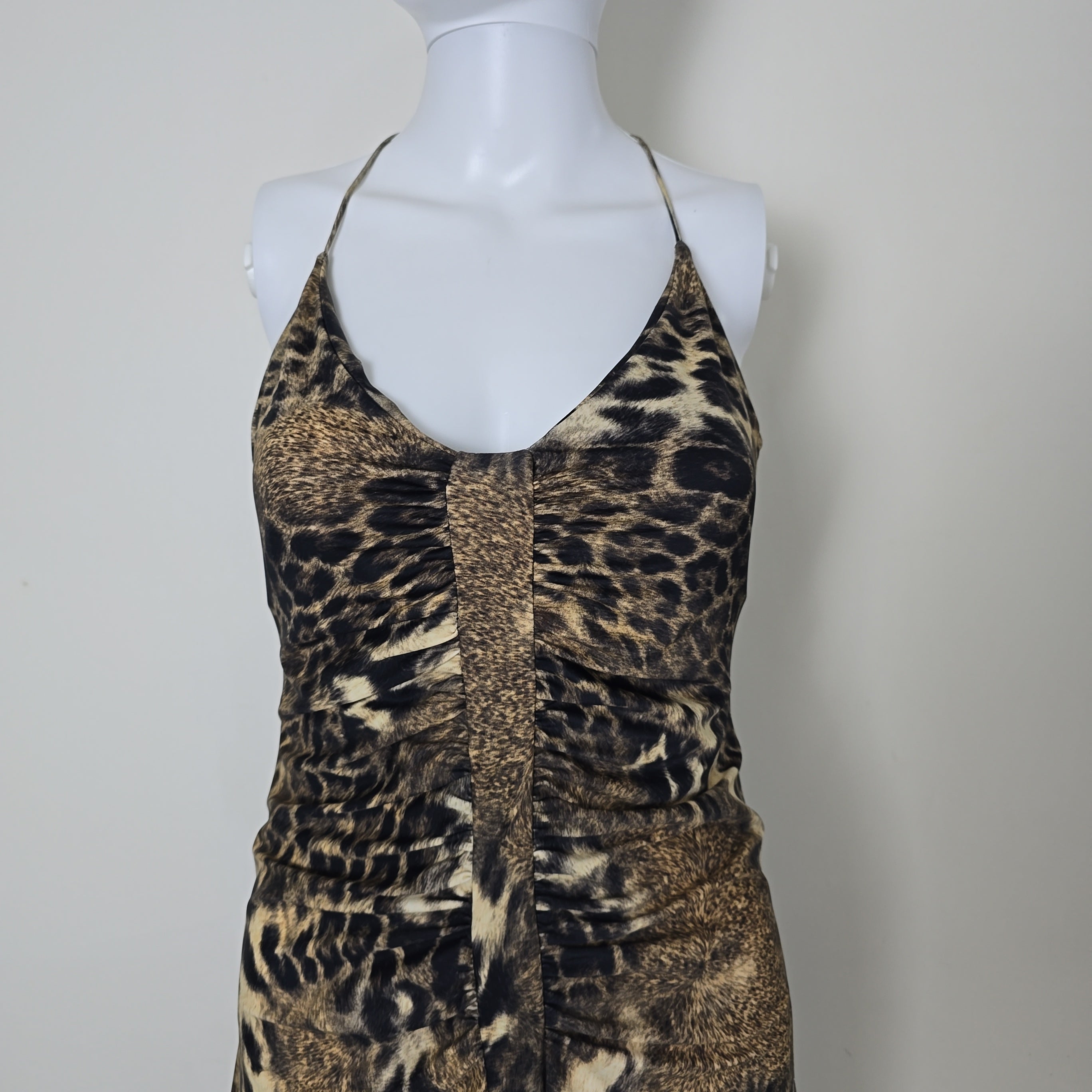 Leopard print dress on a mannequin against a plain background