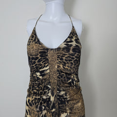 Leopard print dress on a mannequin against a plain background
