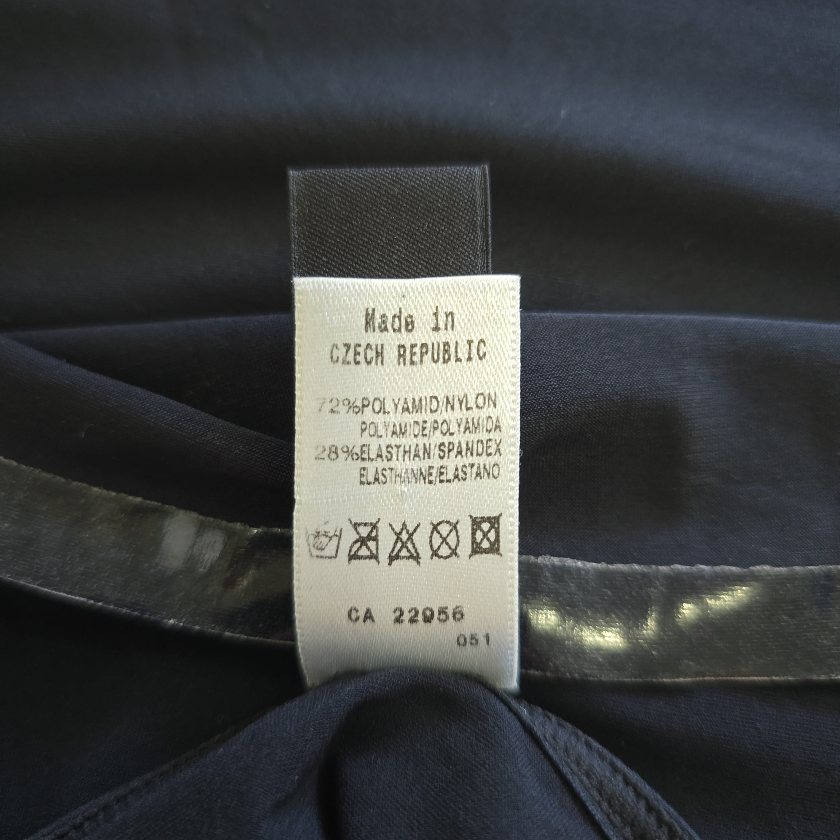 Clothing label on a dark fabric background
